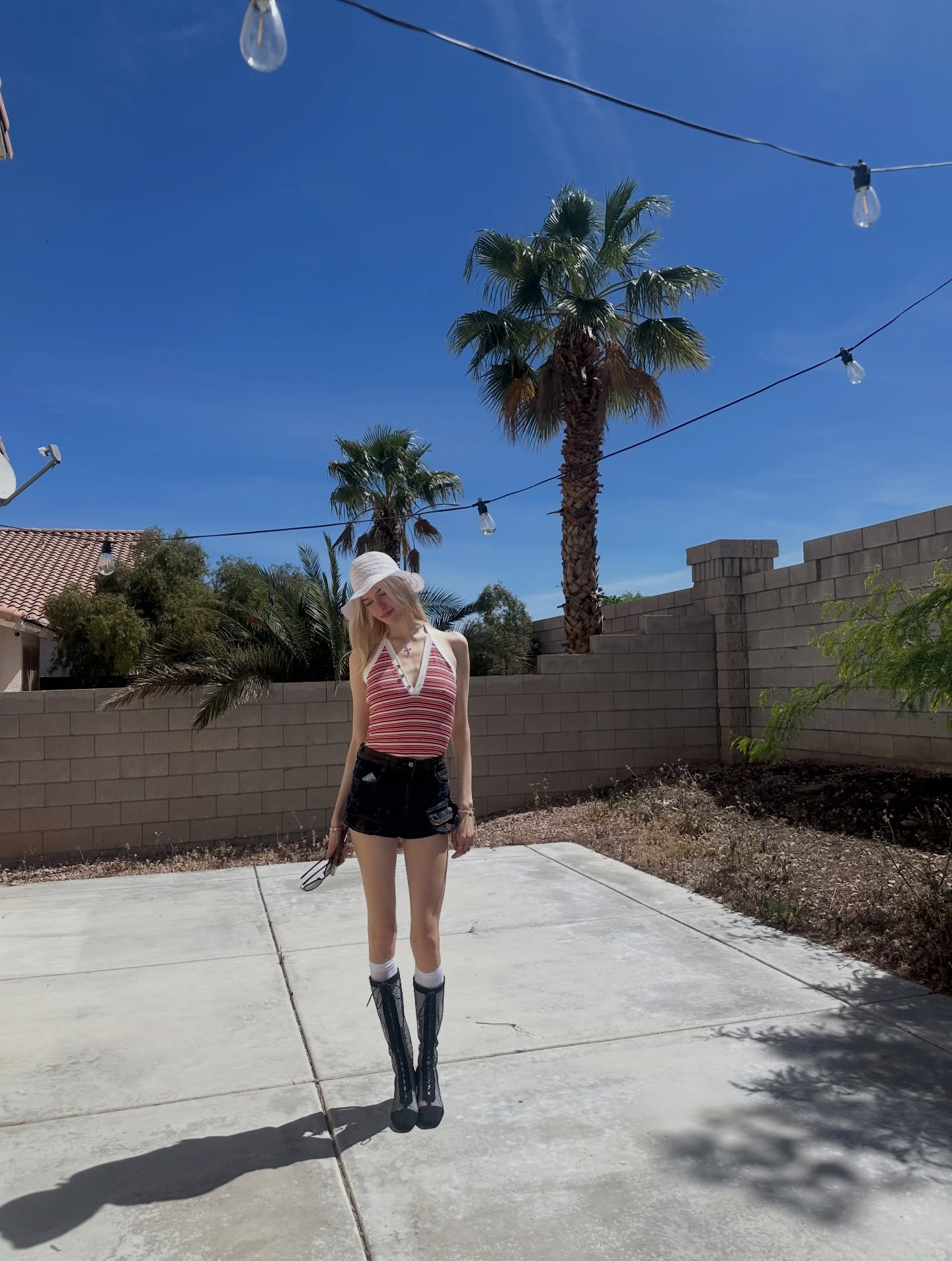 Desert outfit with striped top and cowboy boots