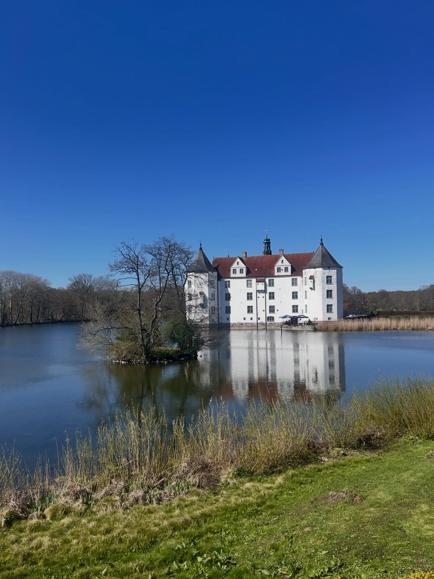 Castle reflected in still lake